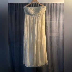 Elegant strapless cream gown with beaded top